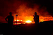 People watch the moving lava lake from the rim