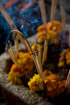 Burning incense in front of an altar in the Tham Phu Kham cave near Vang Vieng Laos